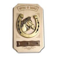 Wieszak z podkową i koniem na szczęście.