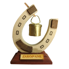 Podkowa drewniana na podstawce frezowanej.